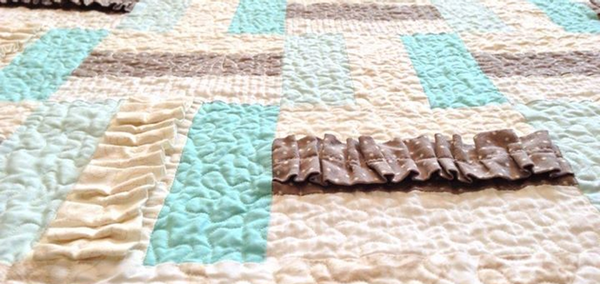 A picture of a quilt, that serves as the Connecting Quilters facebook group's cover photo